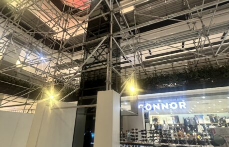 Multi-level aluminium scaffolding for balustrade upgrade alongside open retail stores at Westfield Parramatta Sydney